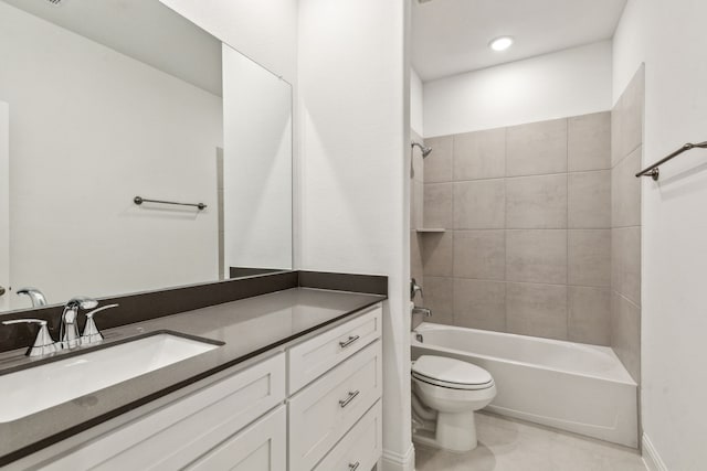 full bathroom with vanity, toilet, and tiled shower / bath combo