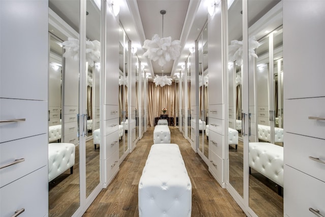 bathroom with a notable chandelier and hardwood / wood-style floors