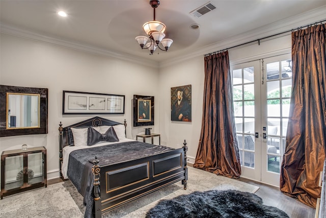 bedroom featuring hardwood / wood-style floors, ceiling fan, ornamental molding, french doors, and access to outside