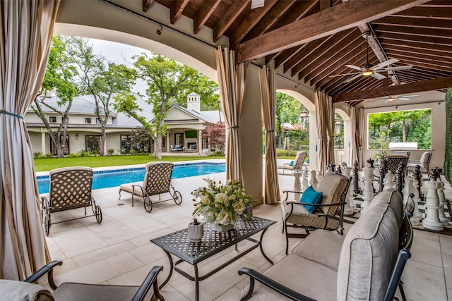 view of patio / terrace featuring an outdoor kitchen, ceiling fan, and outdoor lounge area