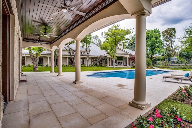 view of pool with ceiling fan and a patio area