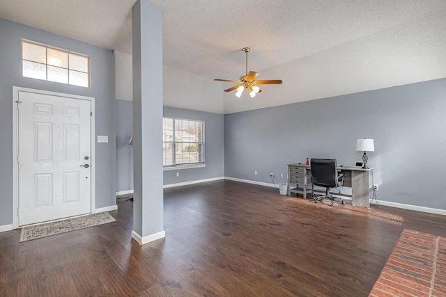 entryway with lofted ceiling, a textured ceiling, ceiling fan, and dark hardwood / wood-style floors