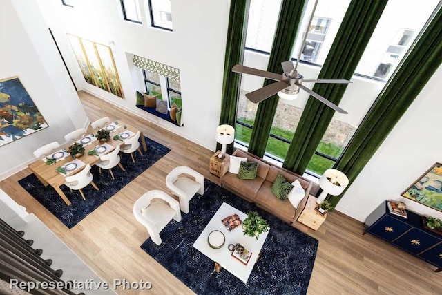 living room featuring hardwood / wood-style flooring and ceiling fan