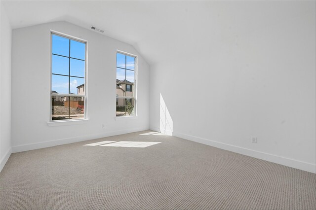 living room featuring a towering ceiling, a brick fireplace, and light hardwood / wood-style floors