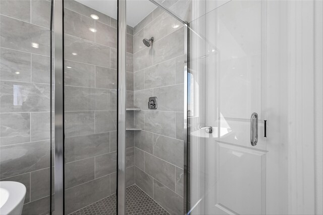 bathroom with plus walk in shower, vanity, and plenty of natural light