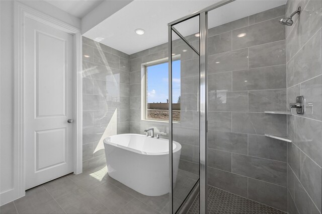 bathroom with shower with separate bathtub and vanity