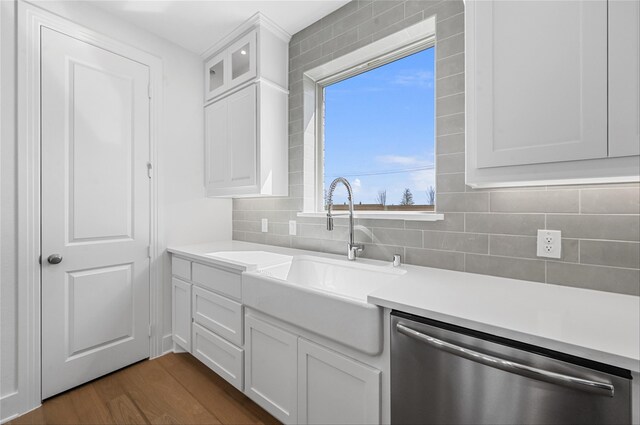 kitchen with light stone counters, pendant lighting, white cabinets, appliances with stainless steel finishes, and sink