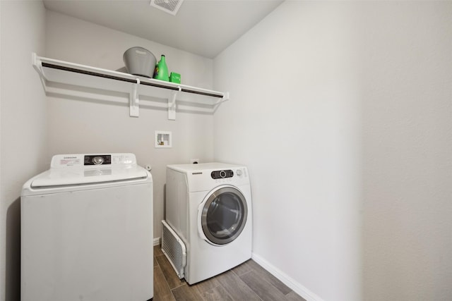 clothes washing area featuring washing machine and dryer