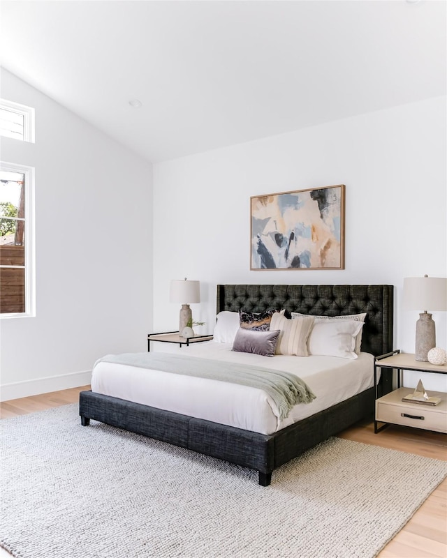 bedroom with hardwood / wood-style floors