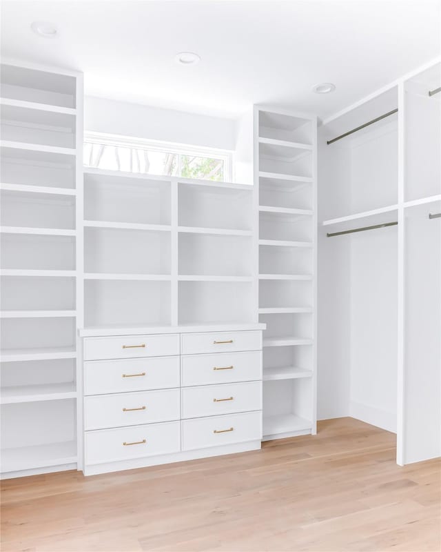 walk in closet featuring light hardwood / wood-style floors