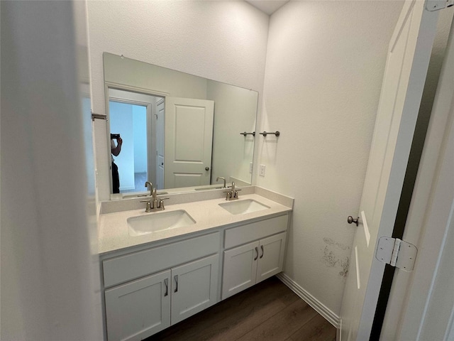 bathroom featuring vanity and hardwood / wood-style flooring