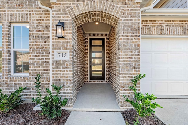 view of exterior entry featuring a garage