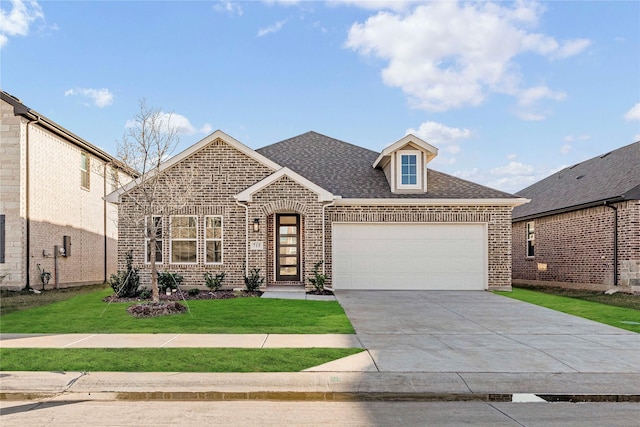 view of front of house featuring a front lawn and a garage