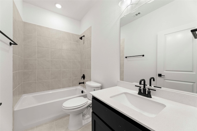 full bathroom with vanity, tile patterned floors, tiled shower / bath combo, and toilet