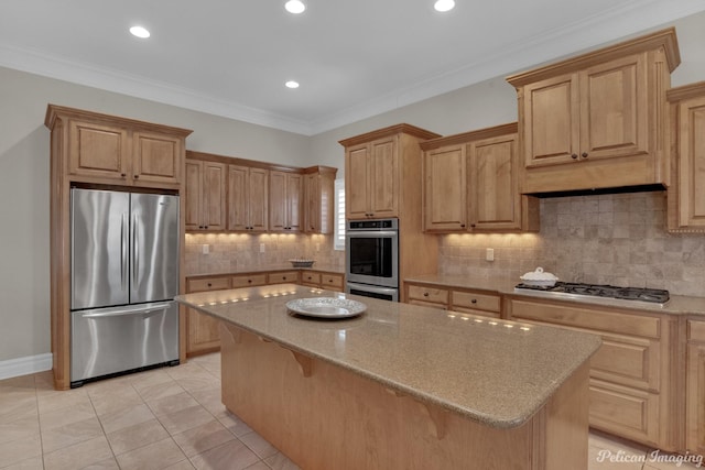 kitchen with stainless steel appliances, backsplash, a kitchen bar, and a center island