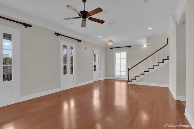 entrance foyer featuring ceiling fan, light wood-type flooring, and crown molding