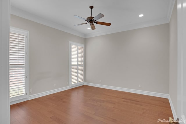 empty room featuring light wood-type flooring, ceiling fan, and crown molding