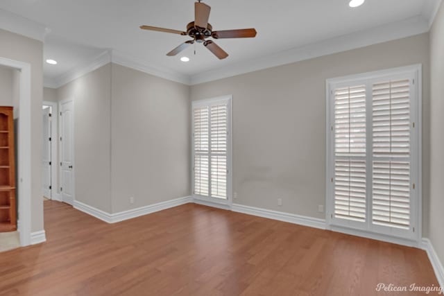 unfurnished room with light hardwood / wood-style floors, ceiling fan, and ornamental molding