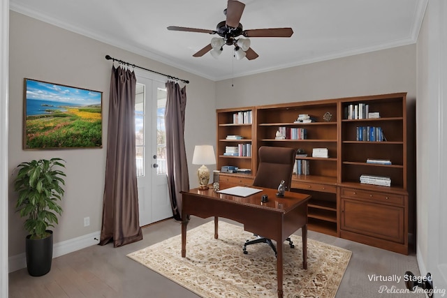 office area featuring ornamental molding, ceiling fan, and light wood-type flooring