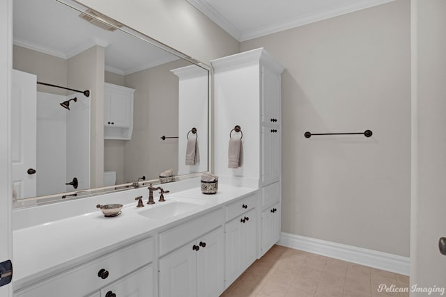 bathroom with crown molding, vanity, and toilet