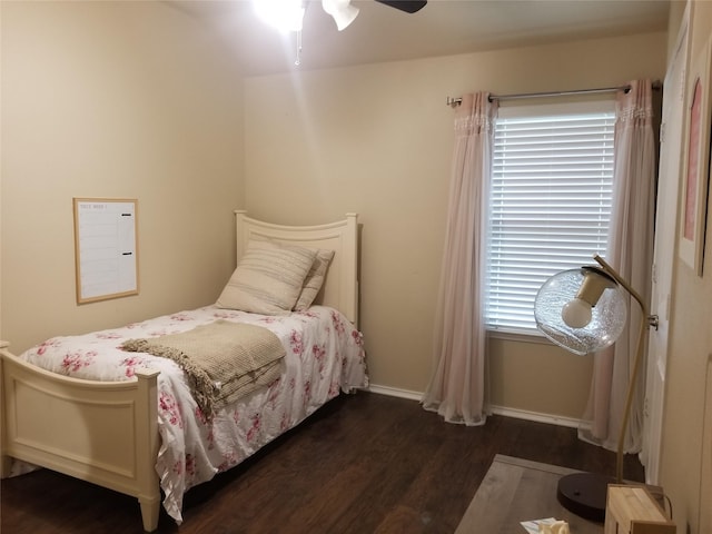 bedroom with ceiling fan and dark hardwood / wood-style floors