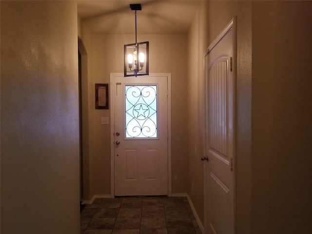 entryway with a chandelier