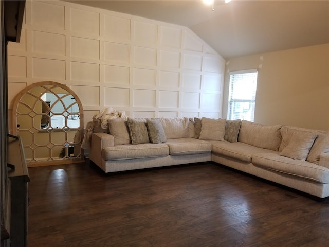 unfurnished living room with vaulted ceiling and dark hardwood / wood-style floors