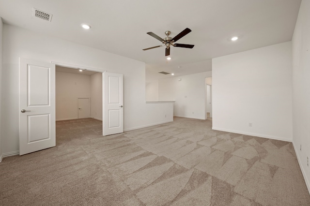 empty room with light carpet and ceiling fan