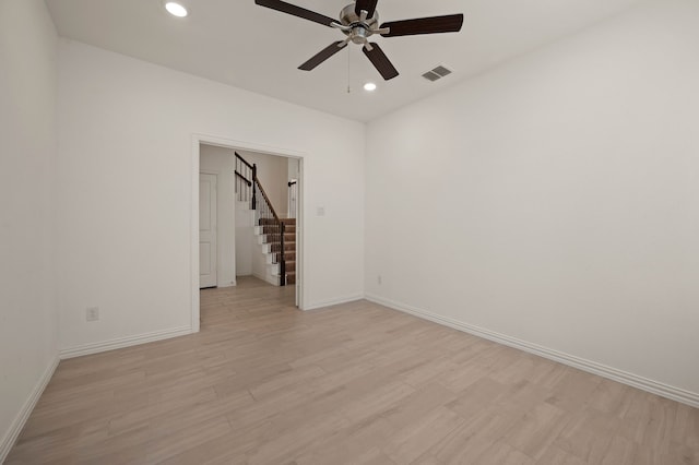 unfurnished room with light hardwood / wood-style floors and ceiling fan