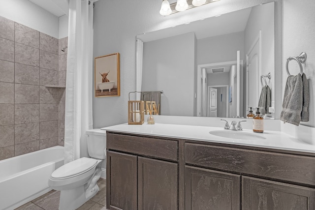 full bathroom featuring toilet, tile patterned floors, vanity, and shower / bath combo