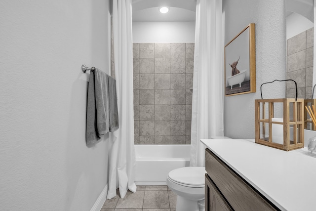 full bathroom with toilet, shower / bath combo with shower curtain, tile patterned floors, and vanity