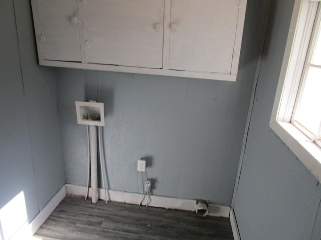 laundry room featuring washer hookup, cabinets, and dark hardwood / wood-style floors