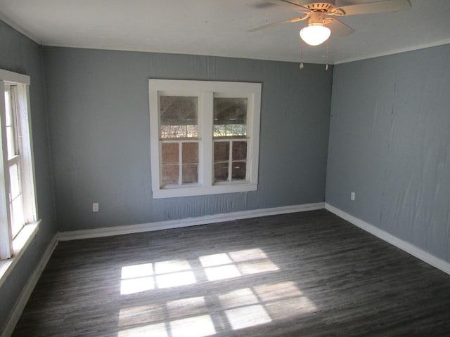 unfurnished room featuring dark wood-type flooring and ceiling fan