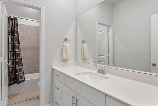 full bathroom with vanity, shower / tub combo with curtain, tile patterned floors, and toilet