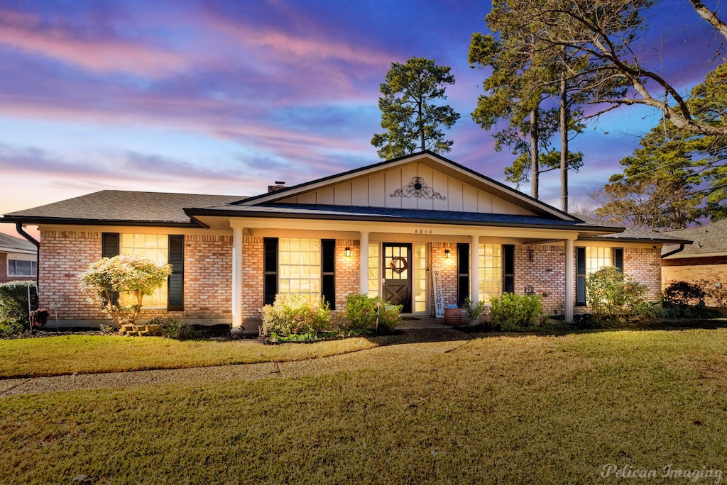 view of front of home with a lawn