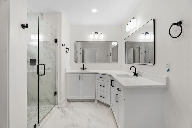 bathroom with an enclosed shower and vanity