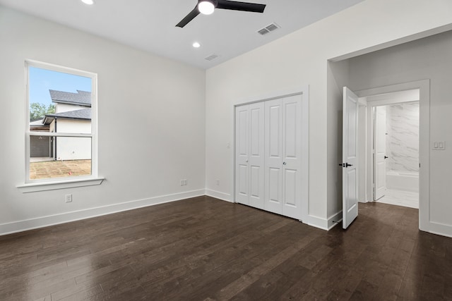 unfurnished bedroom with multiple windows, a closet, ceiling fan, and dark wood-type flooring