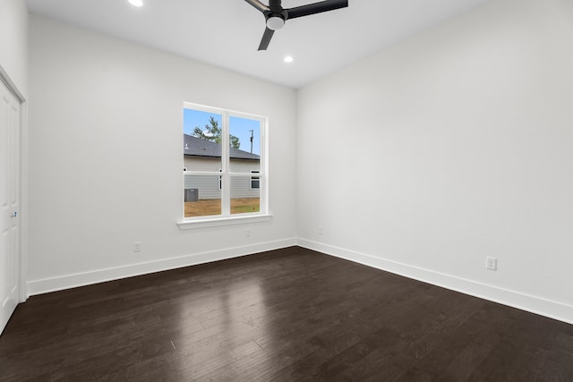 unfurnished room with ceiling fan and dark hardwood / wood-style floors