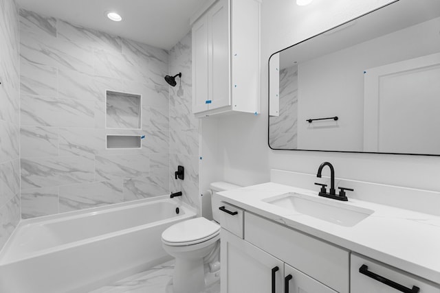 full bathroom featuring toilet, tiled shower / bath combo, and vanity