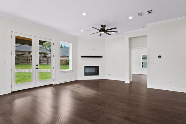 unfurnished living room with french doors, ornamental molding, ceiling fan, and dark hardwood / wood-style floors