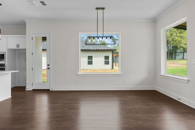 unfurnished dining area featuring dark hardwood / wood-style flooring and ornamental molding