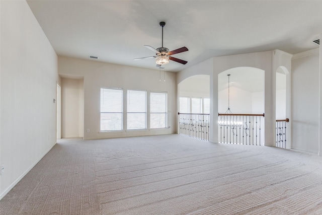 carpeted spare room with ceiling fan