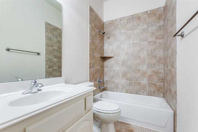 full bathroom with vanity, tile patterned flooring, tiled shower / bath combo, and toilet