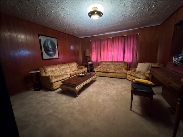 carpeted living room featuring a textured ceiling and wood walls