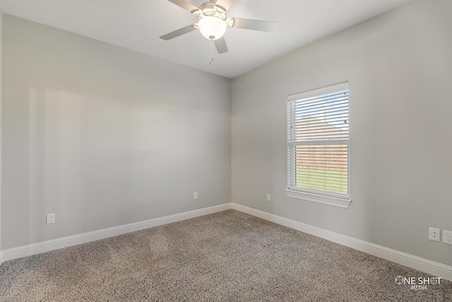 empty room featuring carpet floors and ceiling fan