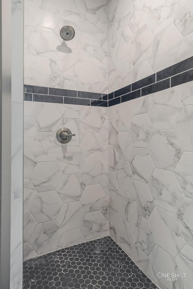 bathroom with tiled shower