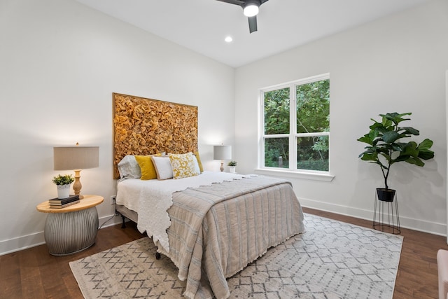 bedroom featuring ceiling fan and dark wood-type flooring