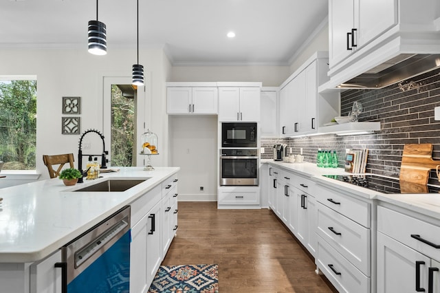 kitchen featuring sink, white cabinetry, light stone counters, hanging light fixtures, and black appliances