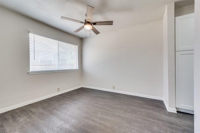 empty room featuring ceiling fan and hardwood / wood-style floors