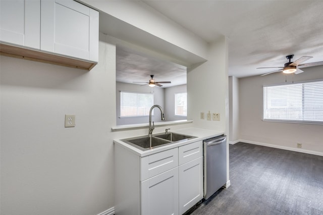 kitchen featuring sink, white cabinetry, a healthy amount of sunlight, and dishwasher